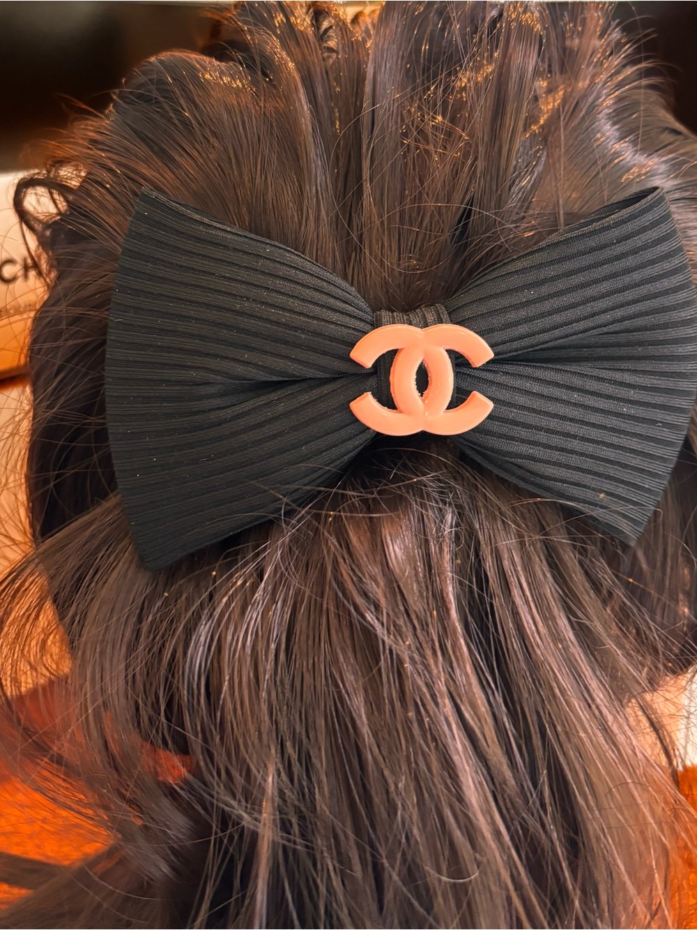 Oversized Black Ribbed Bow Hair Clip with peachy pink nude tone accent